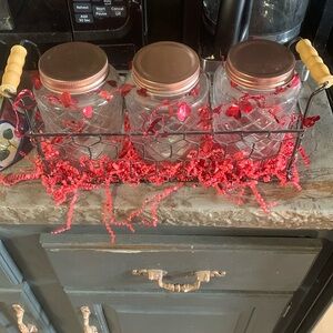 Handmade candy jars in carrying metal basket for Valentine’s Day